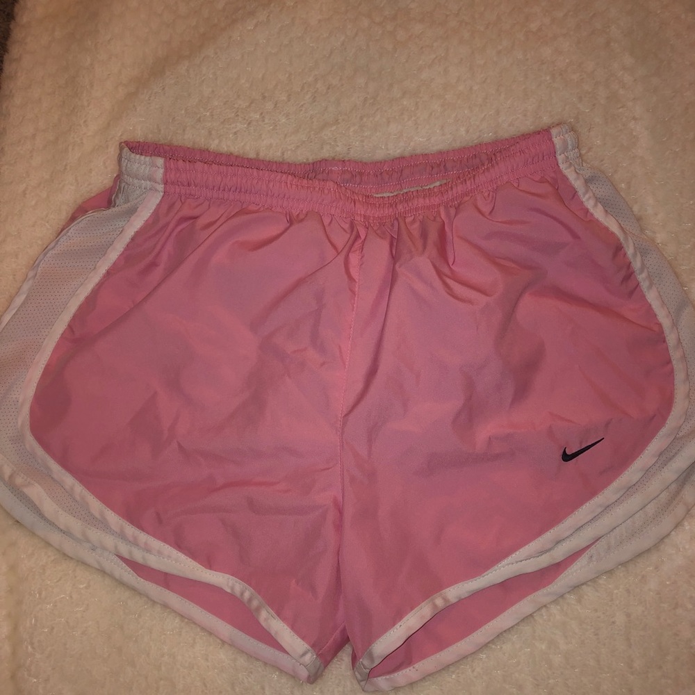 pink and white Nike running shorts